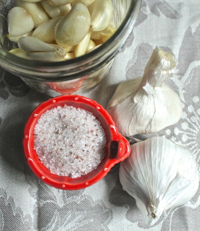 Cloves of Garlic in a jar salt and bulbs