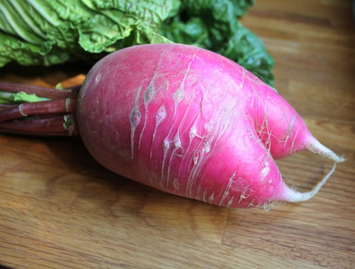 So my farmer told me this was a daikon.  I've never seen a pink one before, but he was spot on from a taste perspective, so we'll just go with it.