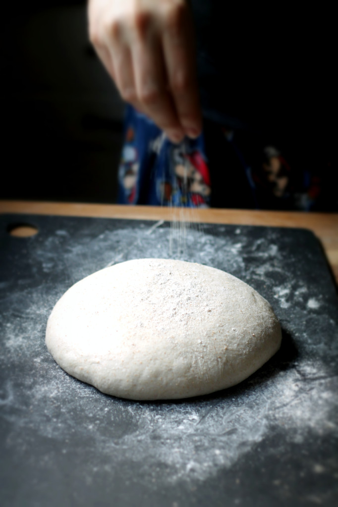Let the dough rest and flatten before sprinkling it with flour and beginning to shape it. 