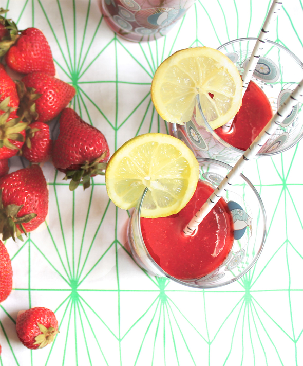 Strawberry soda with straws and lemon